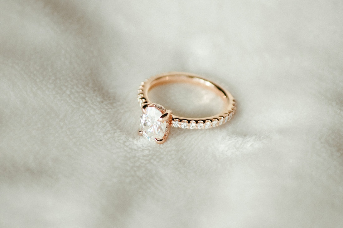 A close up of a ring on a white cloth