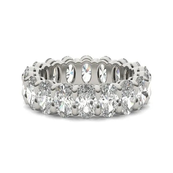 Oval cut crystal eternity band statement ring in polished silver tone with sparkling prong set stones