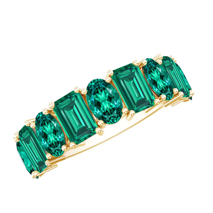 Elegant emerald jewelry collection featuring green gemstone rings, necklaces, earrings, and bracelets.