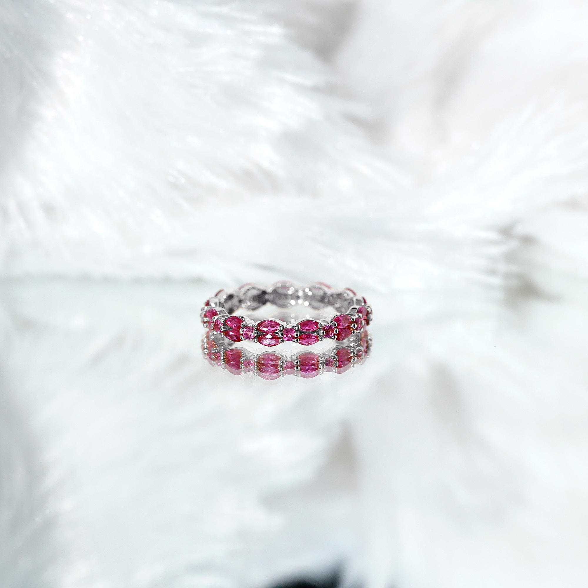 Pink tourmaline jewelry collection featuring blush-pink rings, earrings, necklaces, and bracelets in elegant fine jewelry designs.