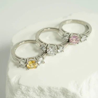 Women’s birthstone rings in gold and silver-tone finishes with colorful birthstone-inspired stones