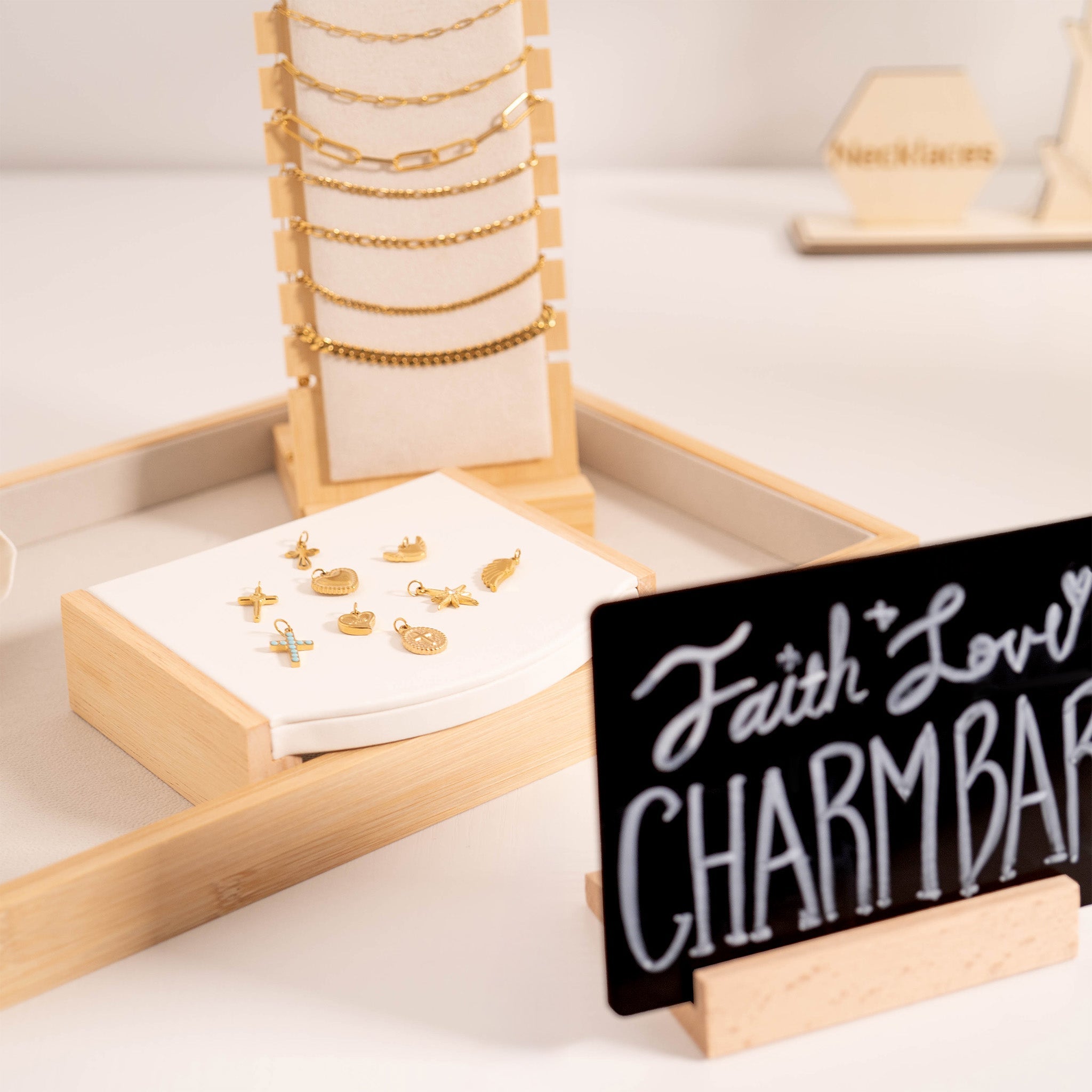 Charm Bar with customizable charms, chains, and charm holders for personalized jewelry