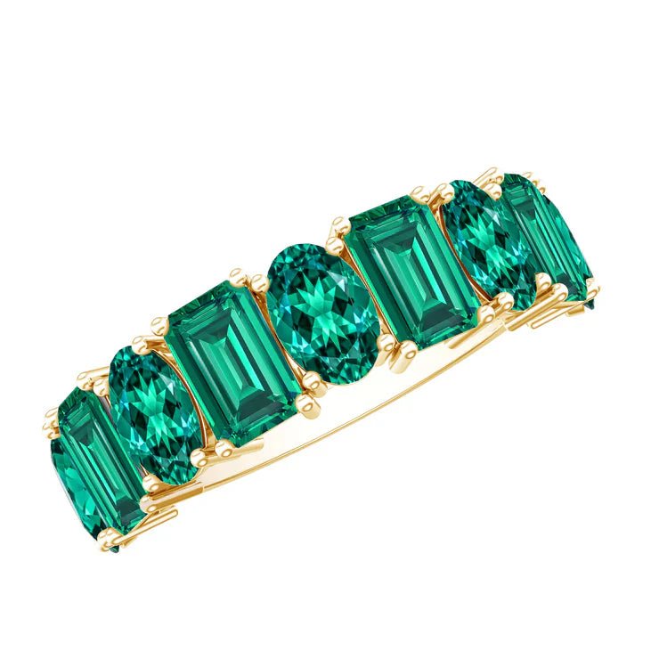 Elegant emerald jewelry collection featuring green gemstone rings, necklaces, earrings, and bracelets.