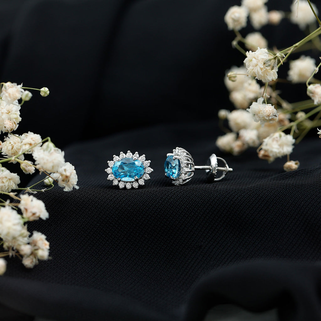 1.6 Carat Oval London Blue Topaz Stud Earrings with Diamond Halo