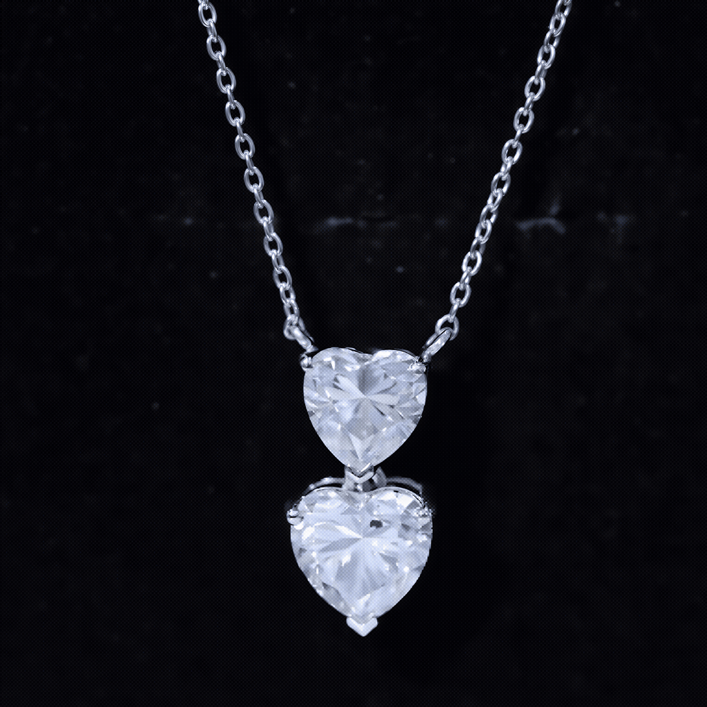 A necklace with two large, clear heart-shaped diamonds suspended from a chain against a dark background.
