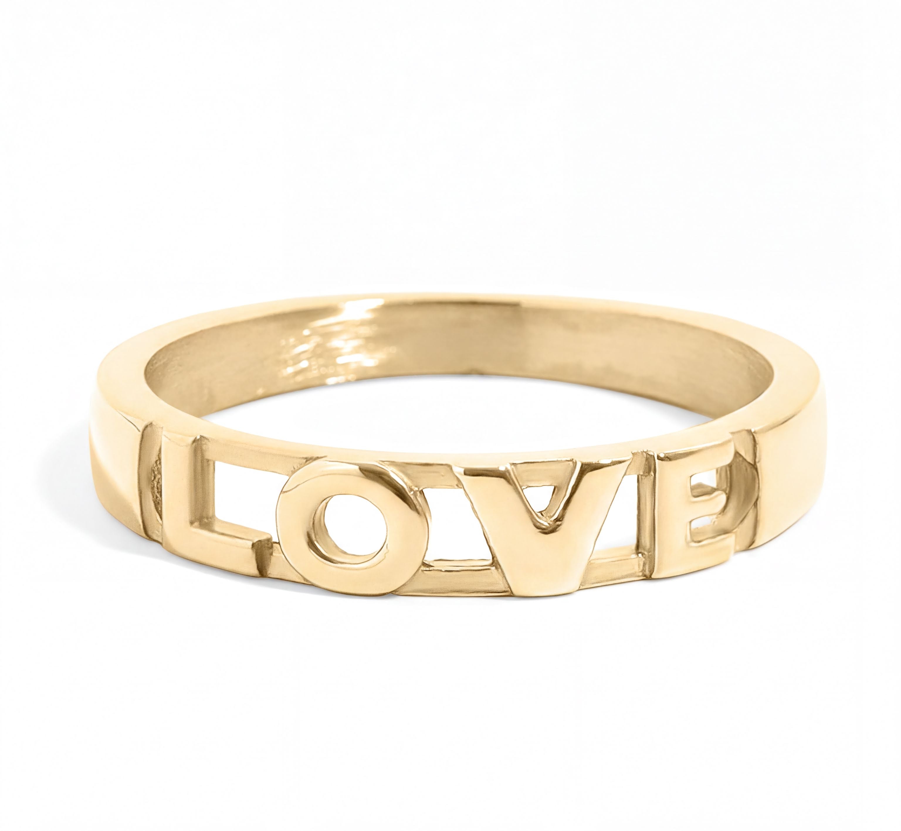 A gold ring with the word "LOVE" engraved in the center.