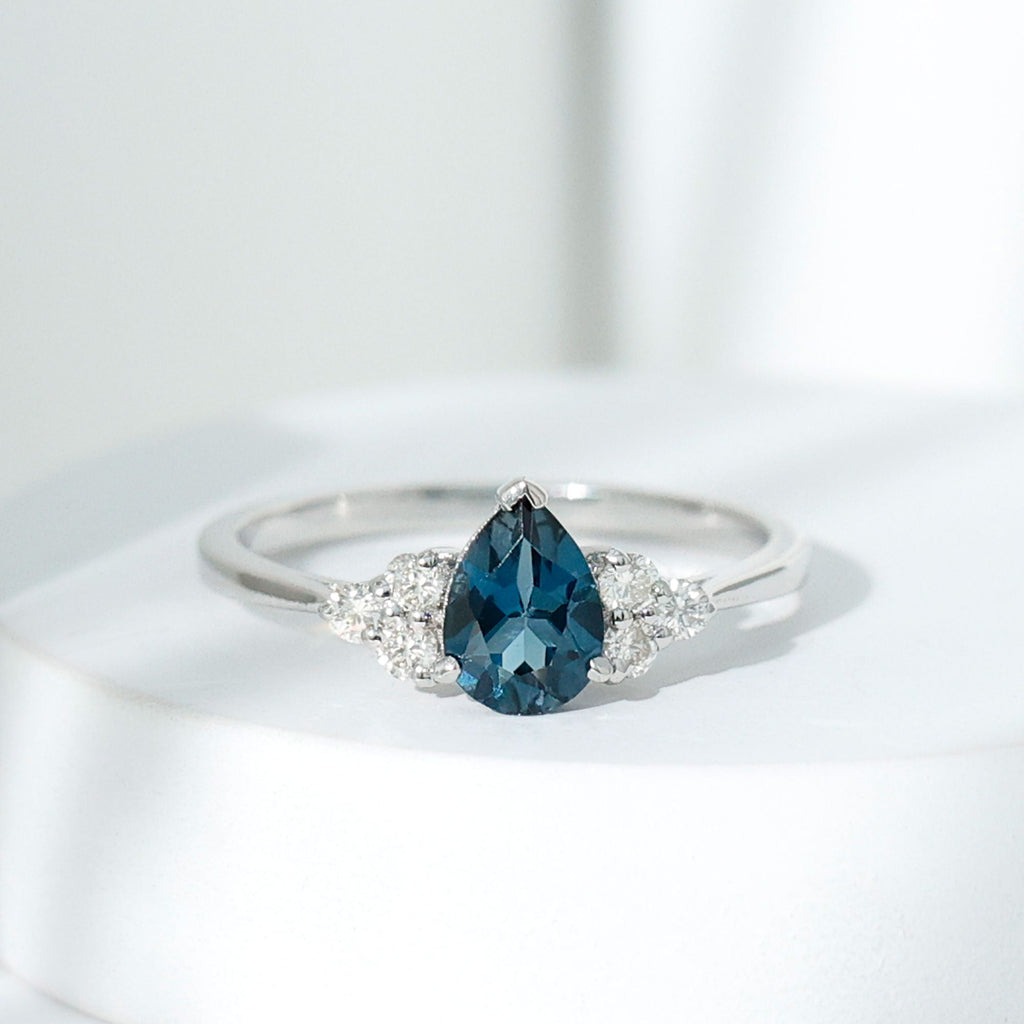 5X7mm Pear Shape London Blue Topaz Engagement Ring with Diamond Trio
