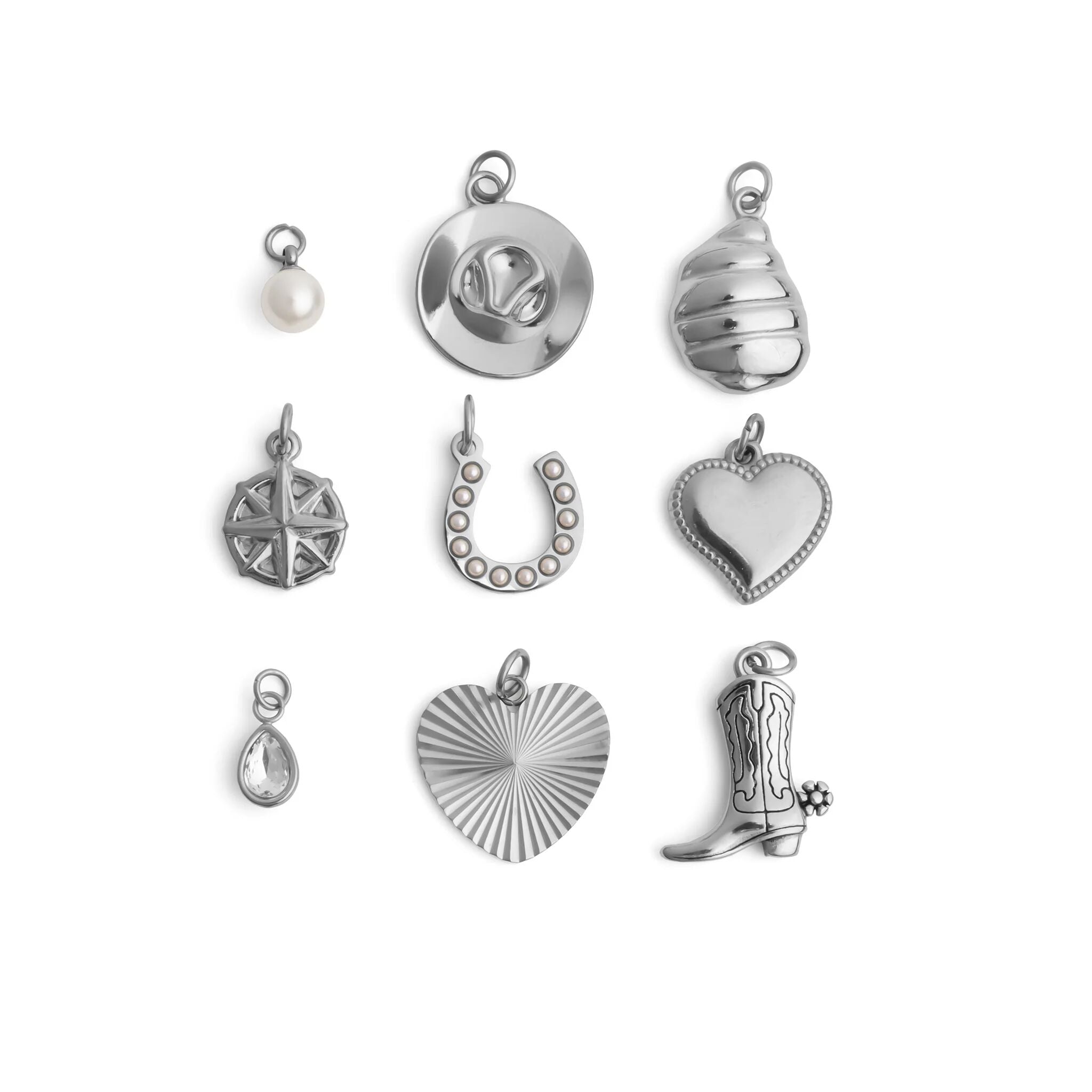 Collection of various silver western charms on a white background