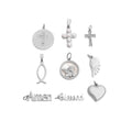Collection of various silver pendants on a white background