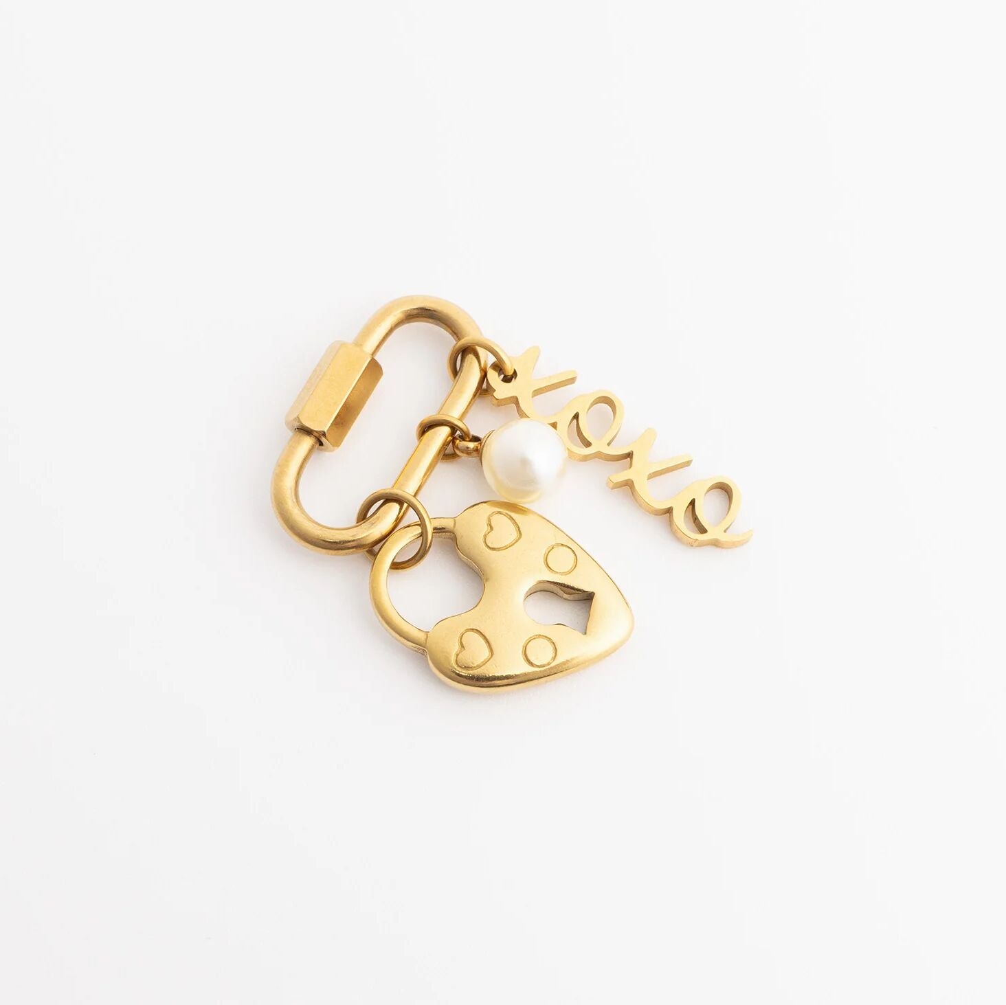 Gold keychain with heart-shaped padlock and 'love' tag on a white background