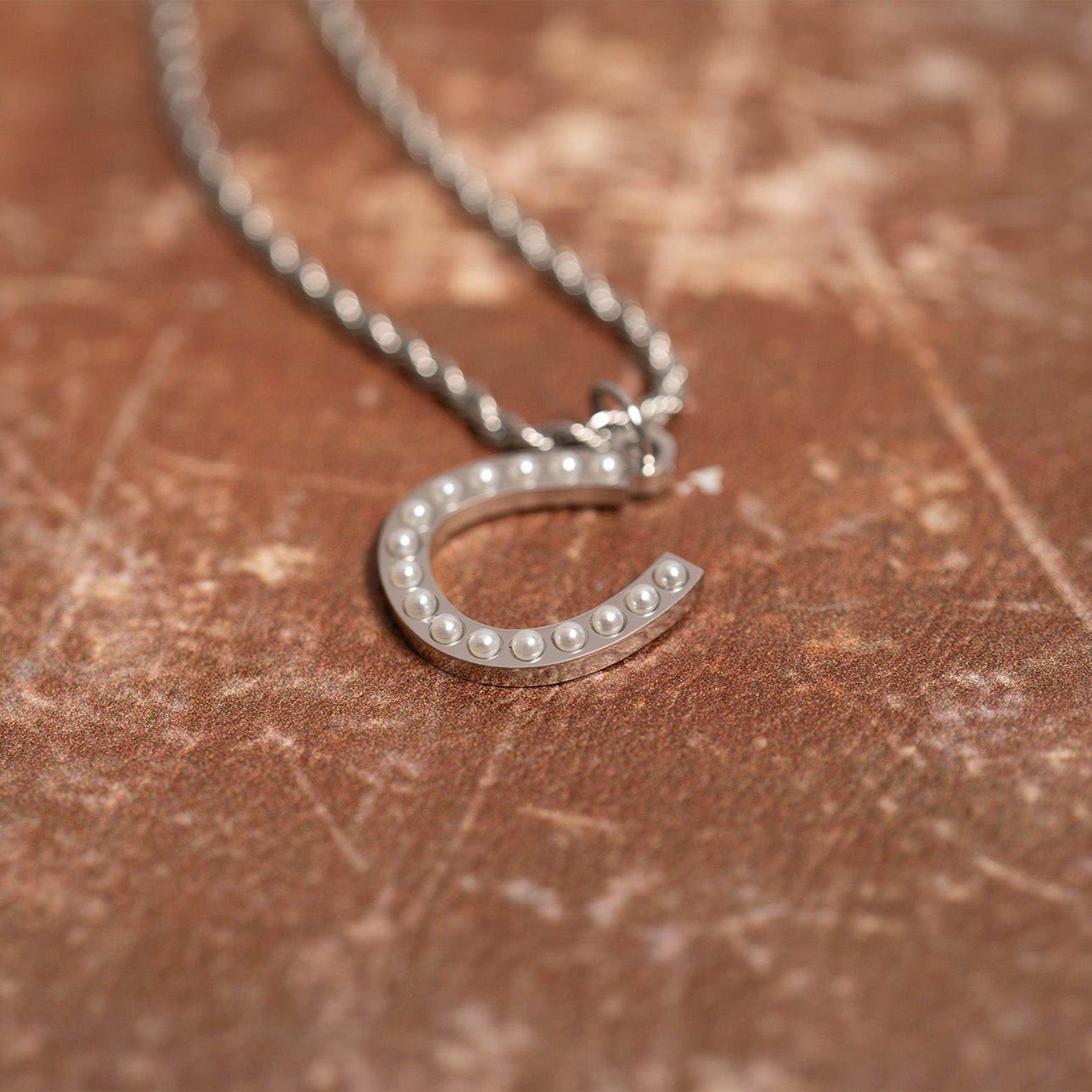 Pearl Horseshoe Charm – Gold PVD Coated Stainless Steel Luck Pendant