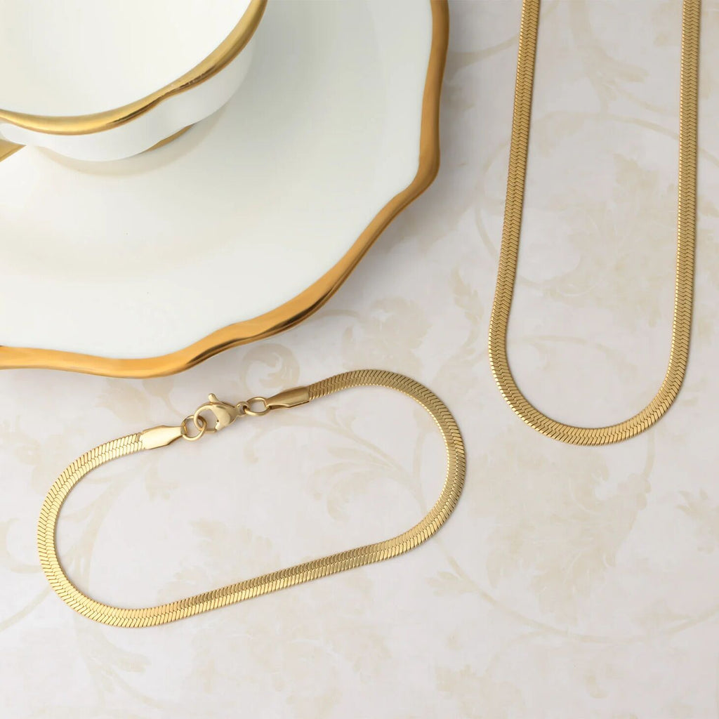 Gold chain necklace on a marble surface