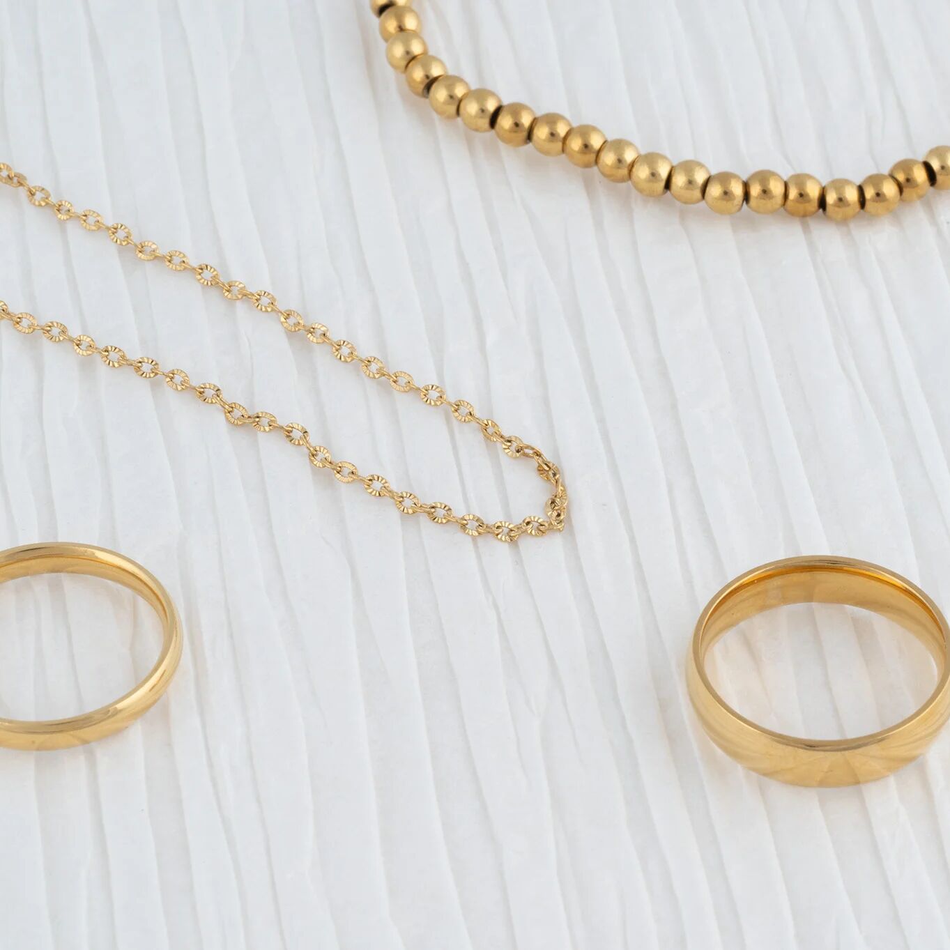 Wholesale Jewelry 14K Gold Filled Plus Satellite Chain Necklace- Studio collection shot with bracelet and rings