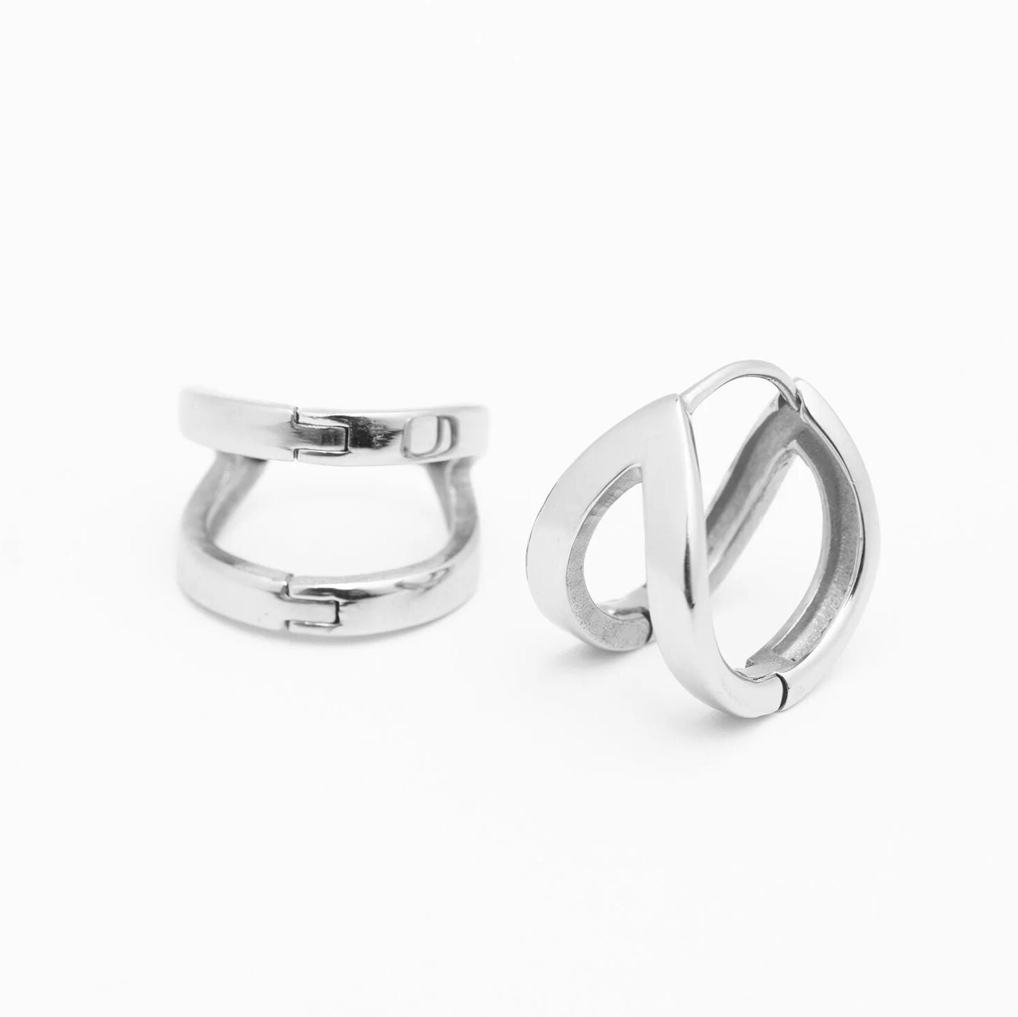 Pair of silver hoop earrings on a white background