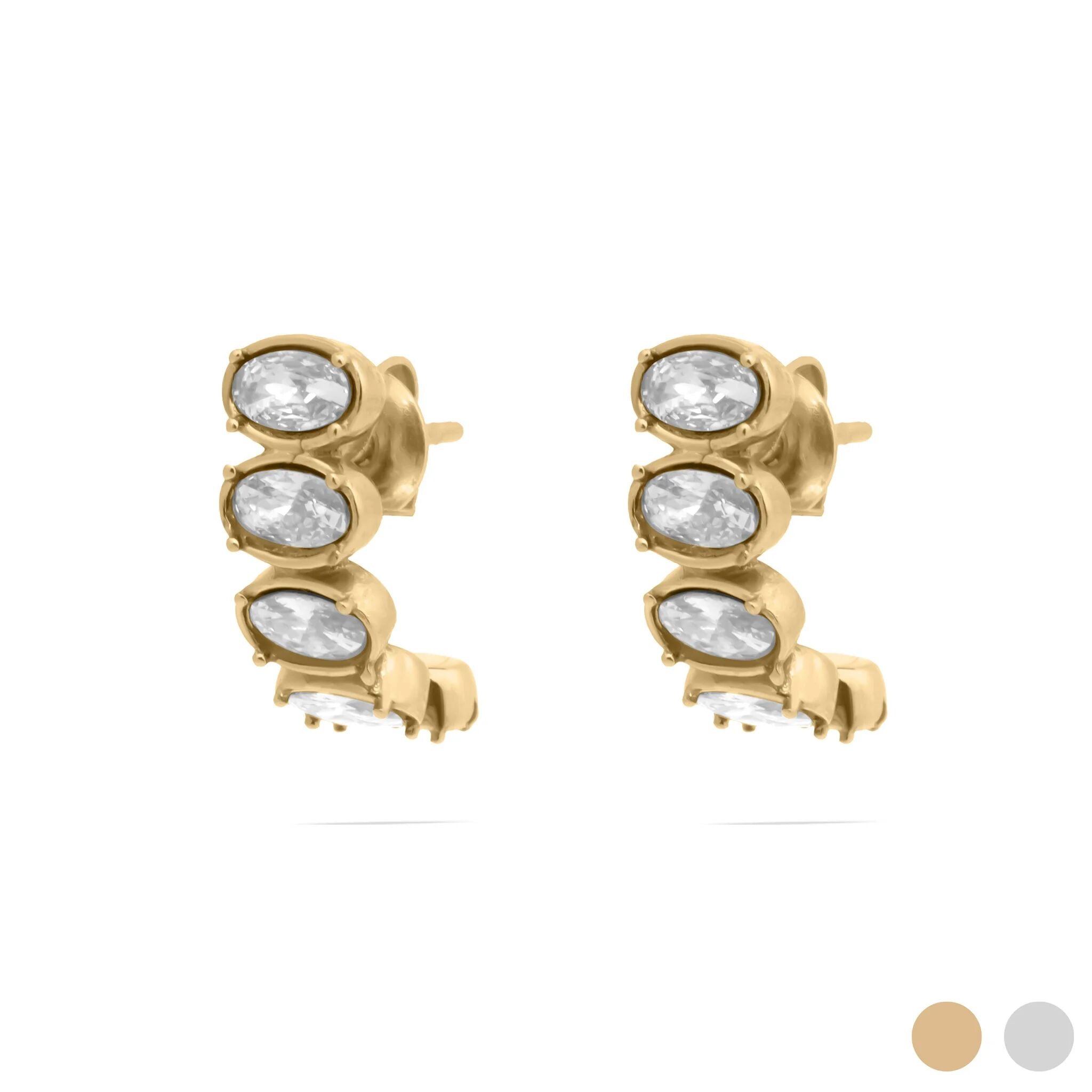 Gold Oval Stone Huggie Earrings with clear stones on a white background
