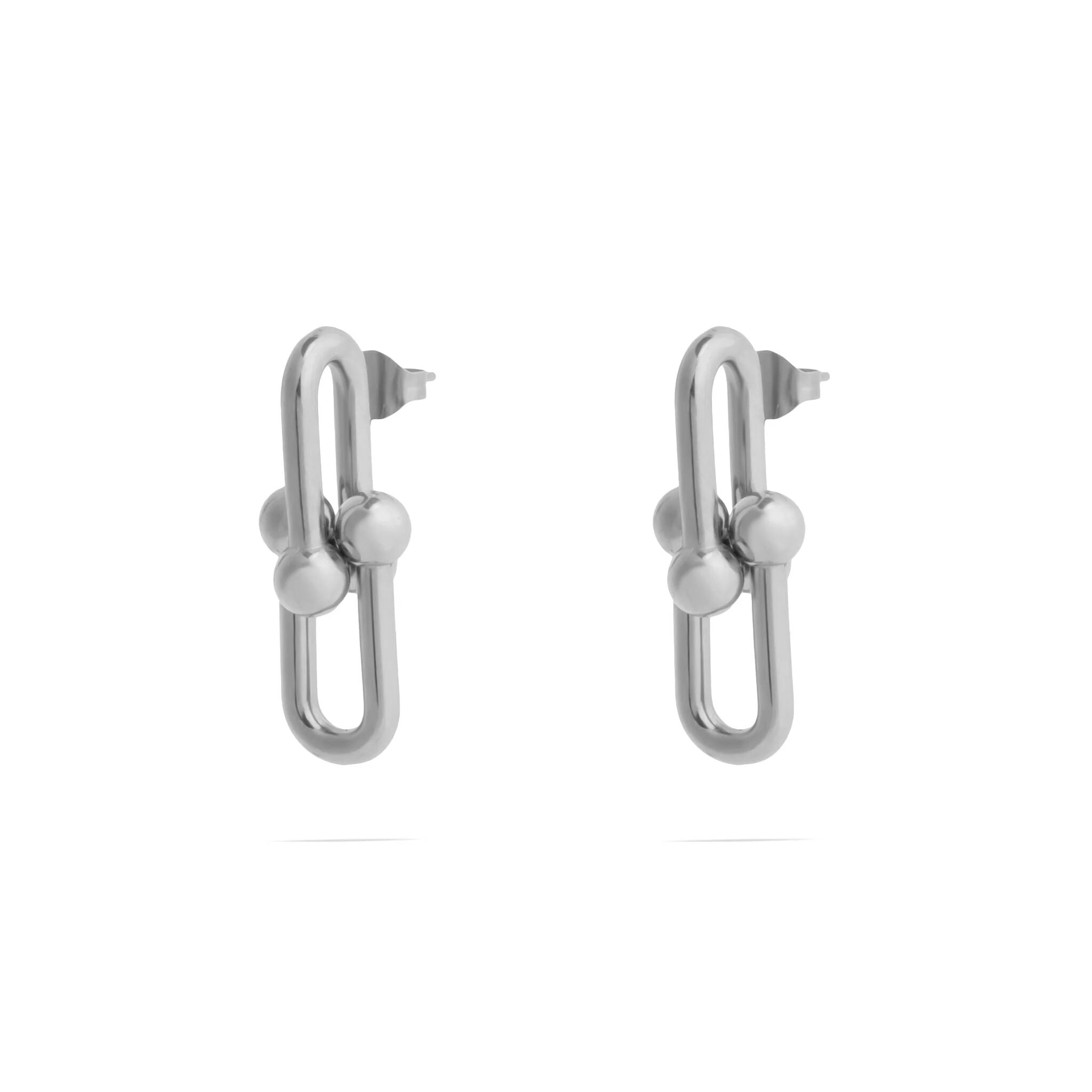 Pair of silver earrings on a white background