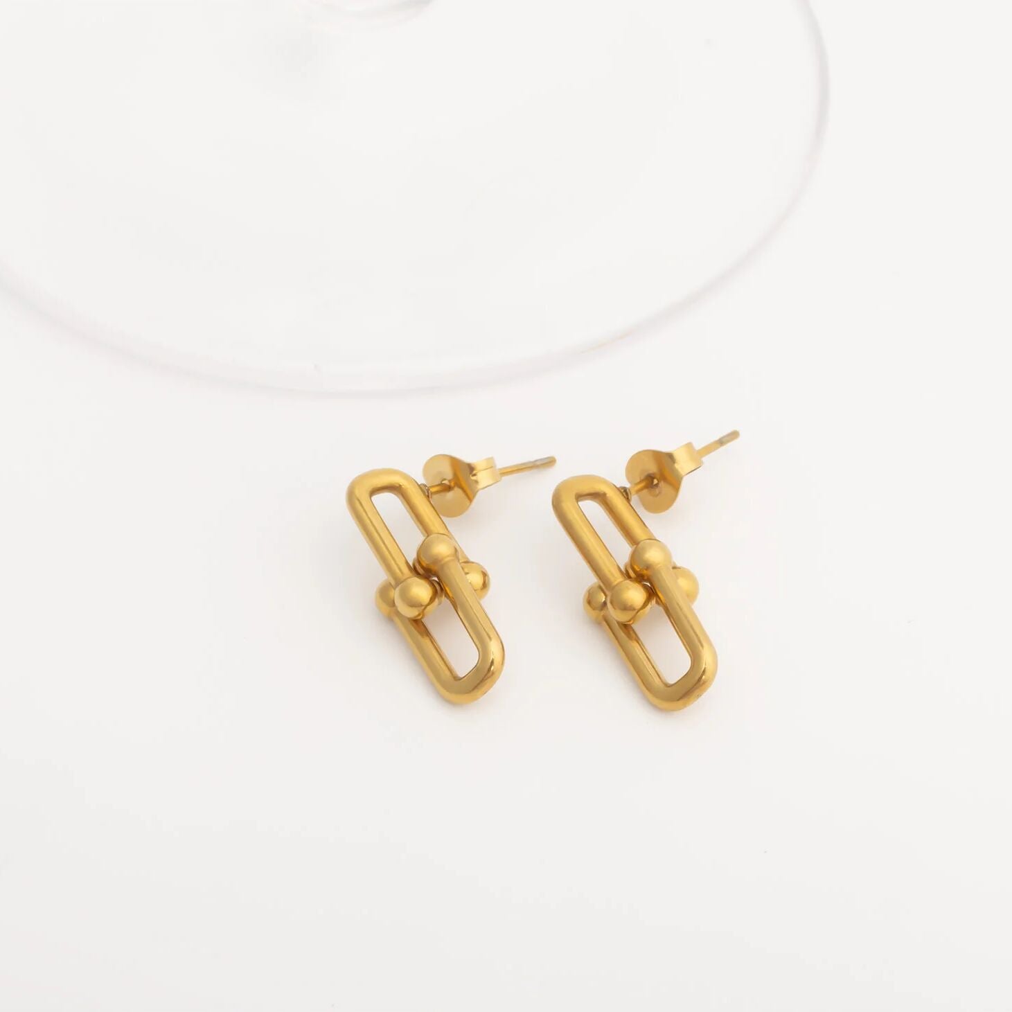 Gold hoop earrings on a white background