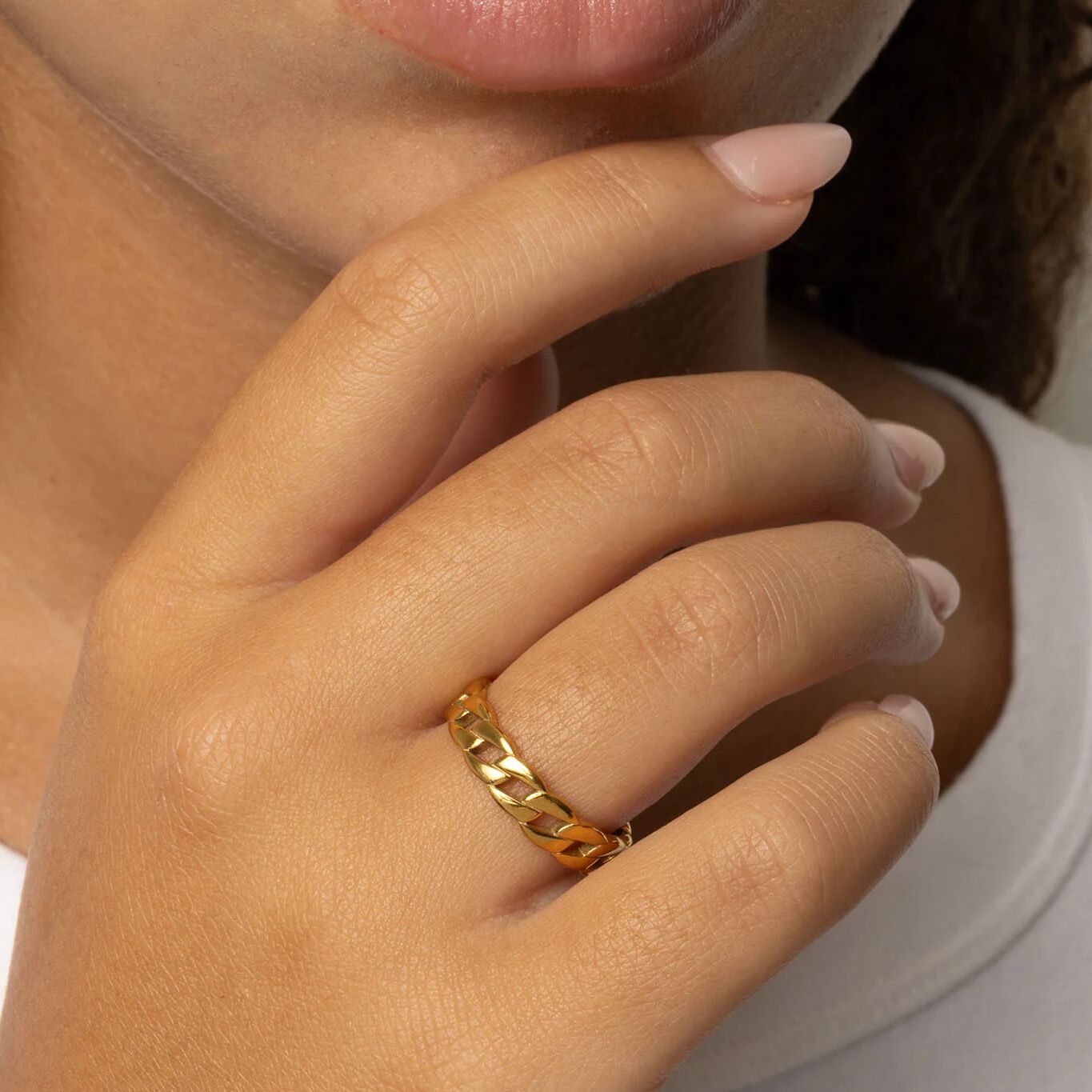 Close-up of a hand wearing a gold Curb Chain Stacking Ring 