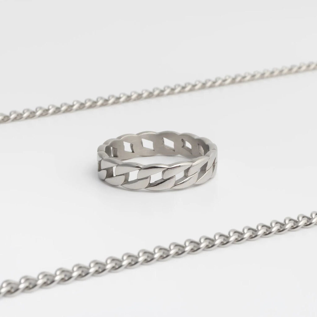 Silver Curb Chain Stacking Ring with a textured design on a white background