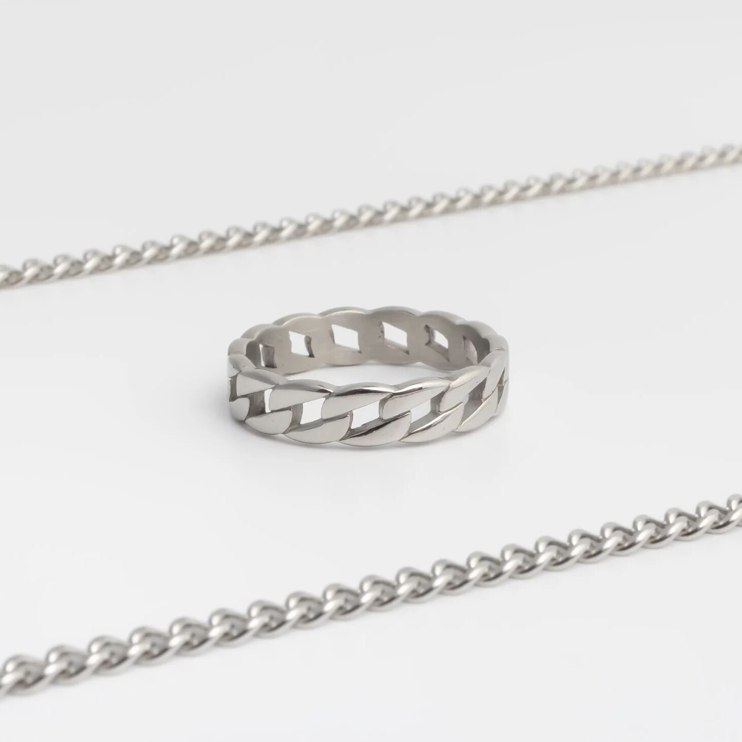 Silver Curb Chain Stacking Ring with a textured design on a white background