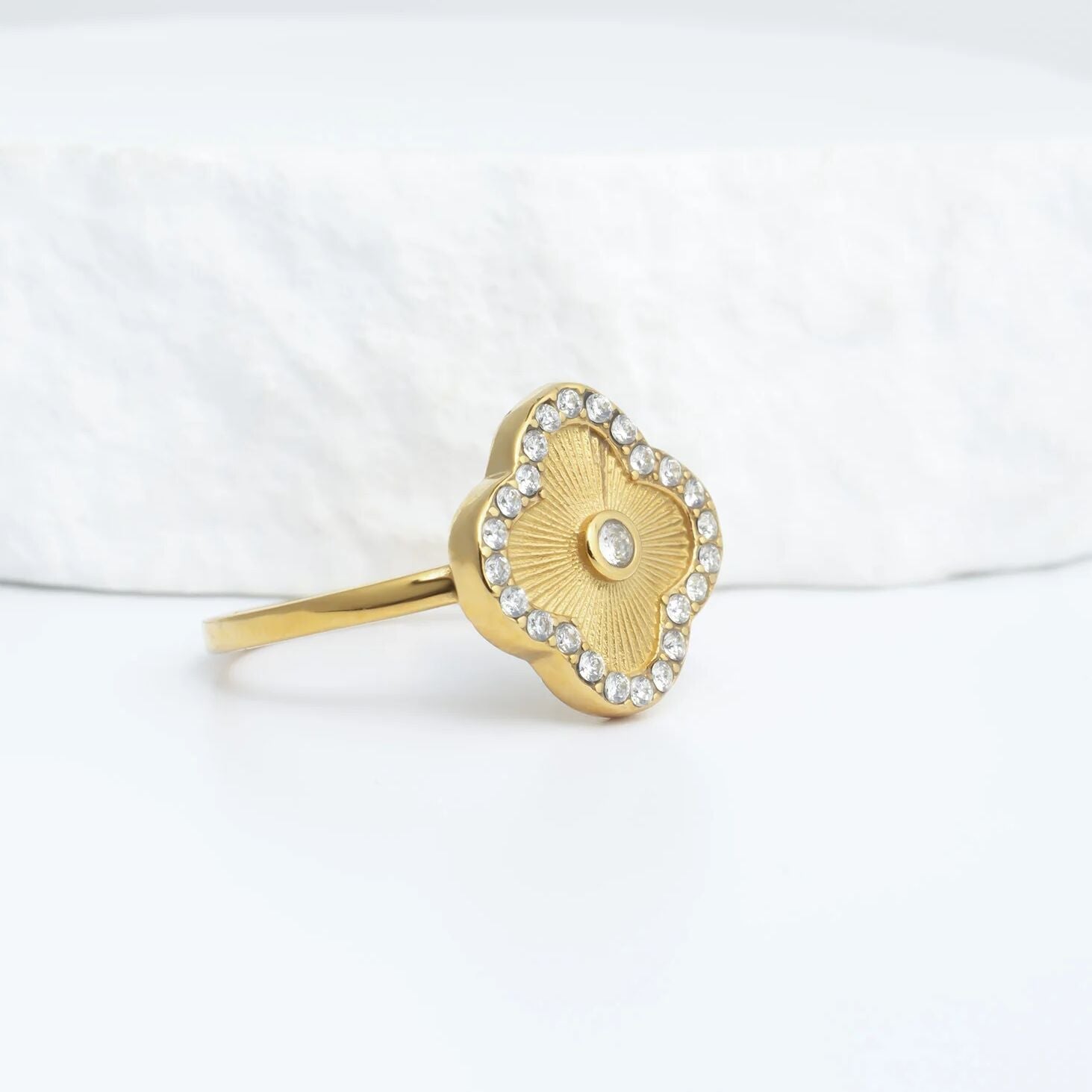 Gold Floral Motif Ring with a floral design on a white background