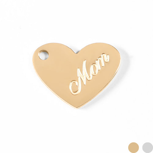 A heart-shaped engraved tag with the word "Mom" written on it.