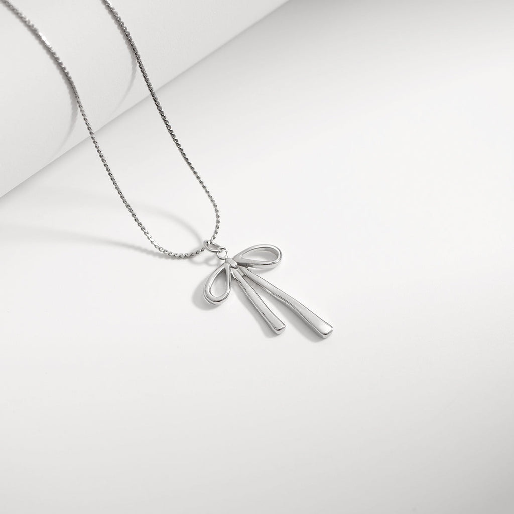 Gold Bow Charm – 18K Gold PVD Stainless Steel Long Bow Pendant | Hypoallergenic Jewelry