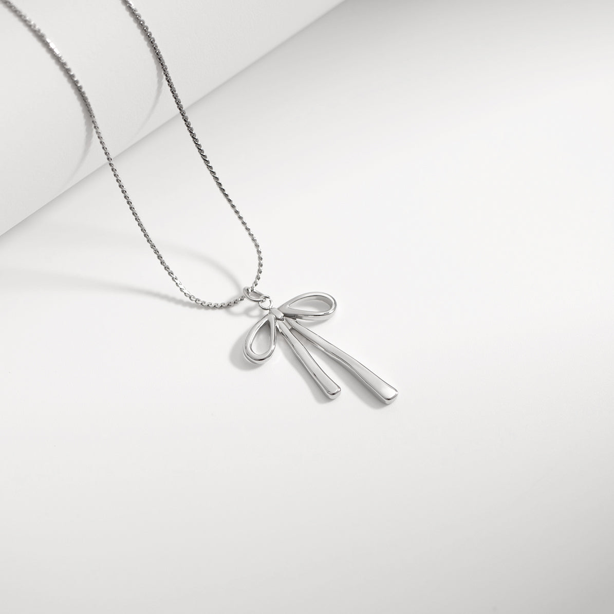 Gold Bow Charm – 18K Gold PVD Stainless Steel Long Bow Pendant | Hypoallergenic Jewelry
