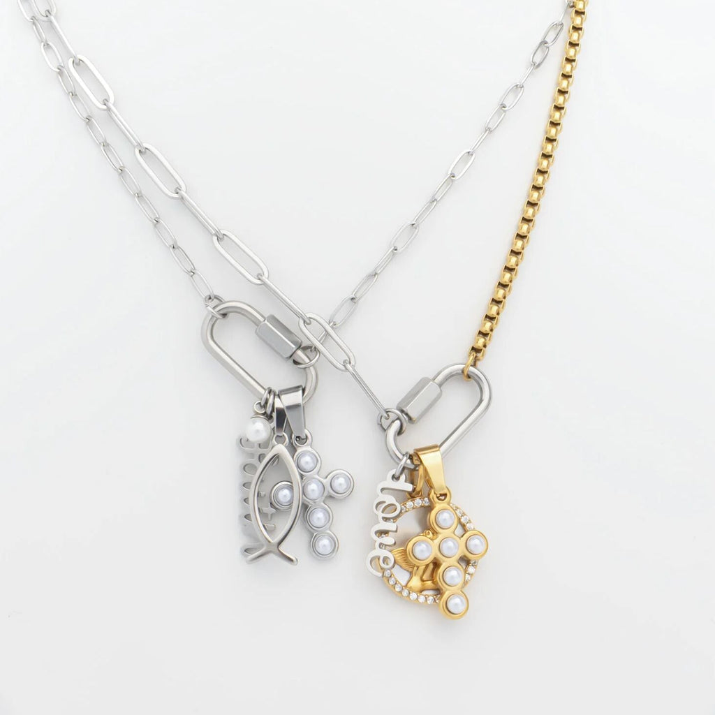 Two necklaces with fish-shaped pendants on a white background