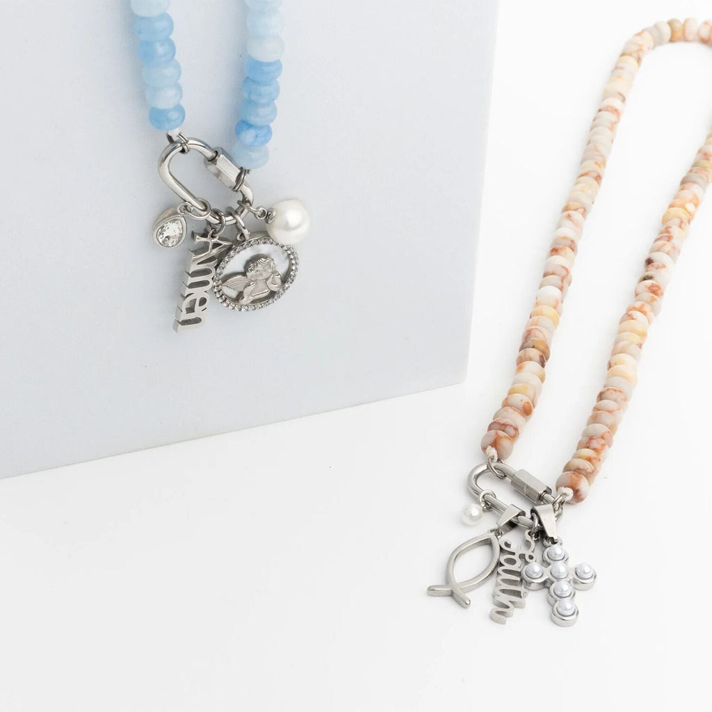Two beaded necklaces with charms on a white background