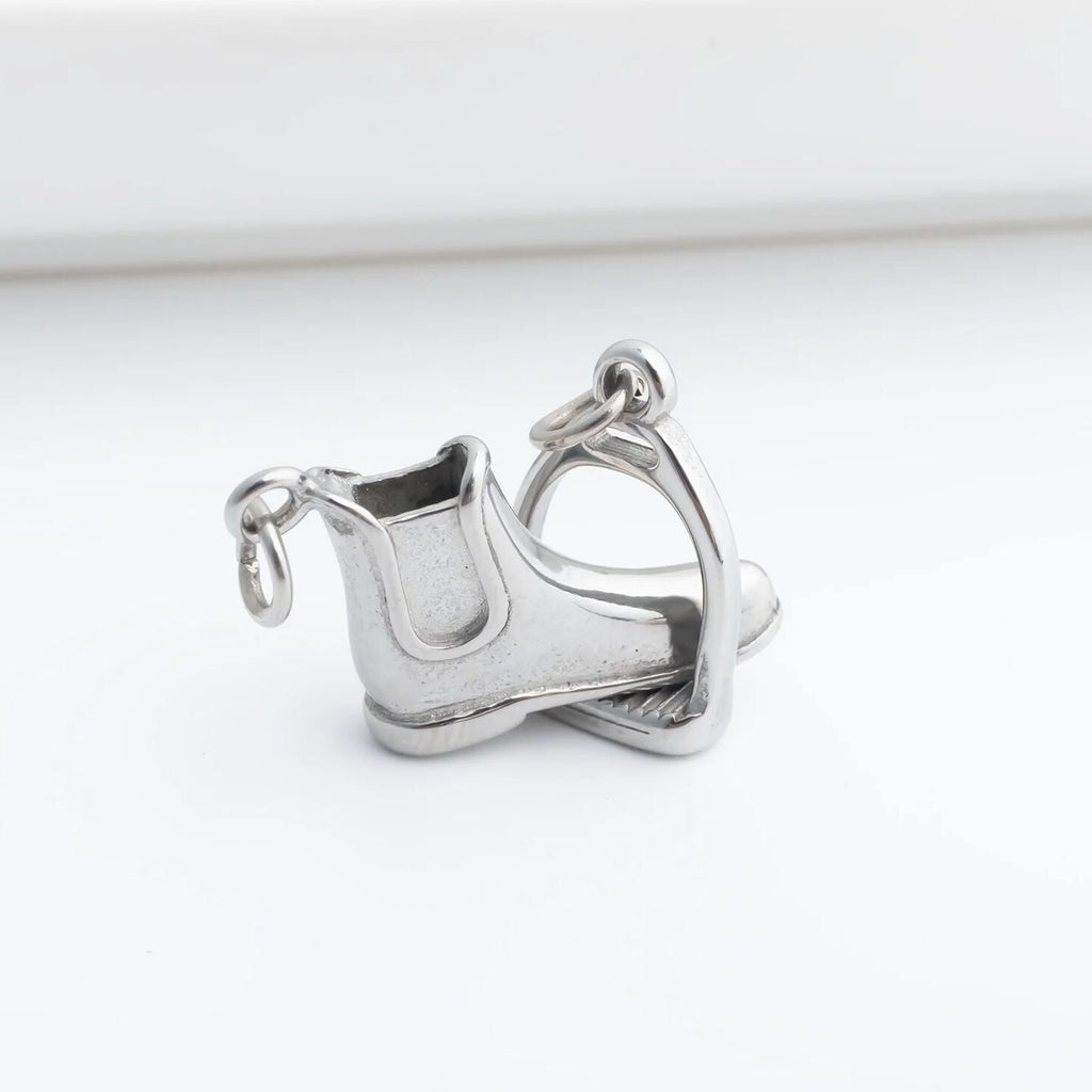Silver boot charm on a white background