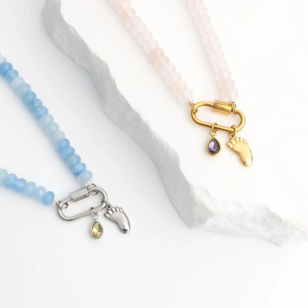 Teo necklaces with Baby Foot Charm on a white background