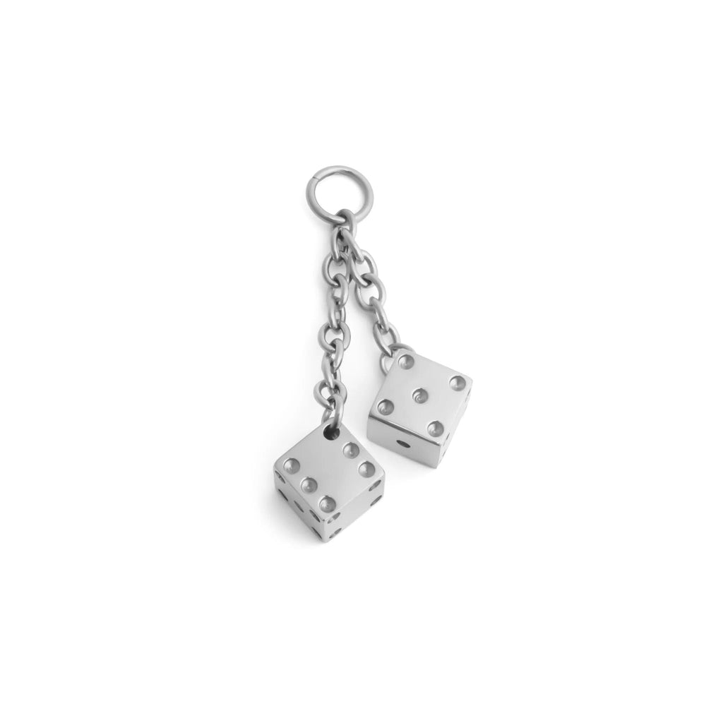 Silver dice charm on a white background