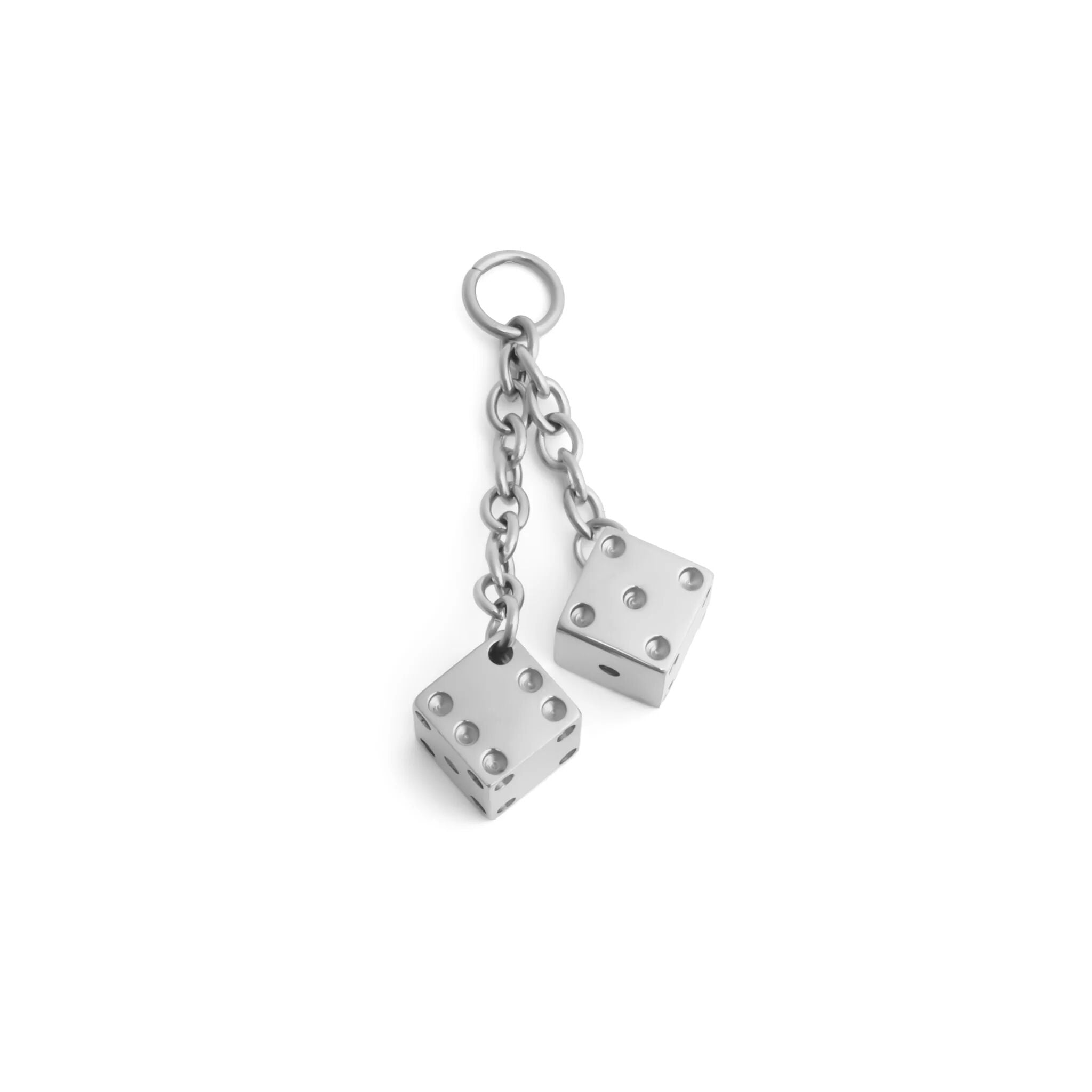 Silver dice charm on a white background