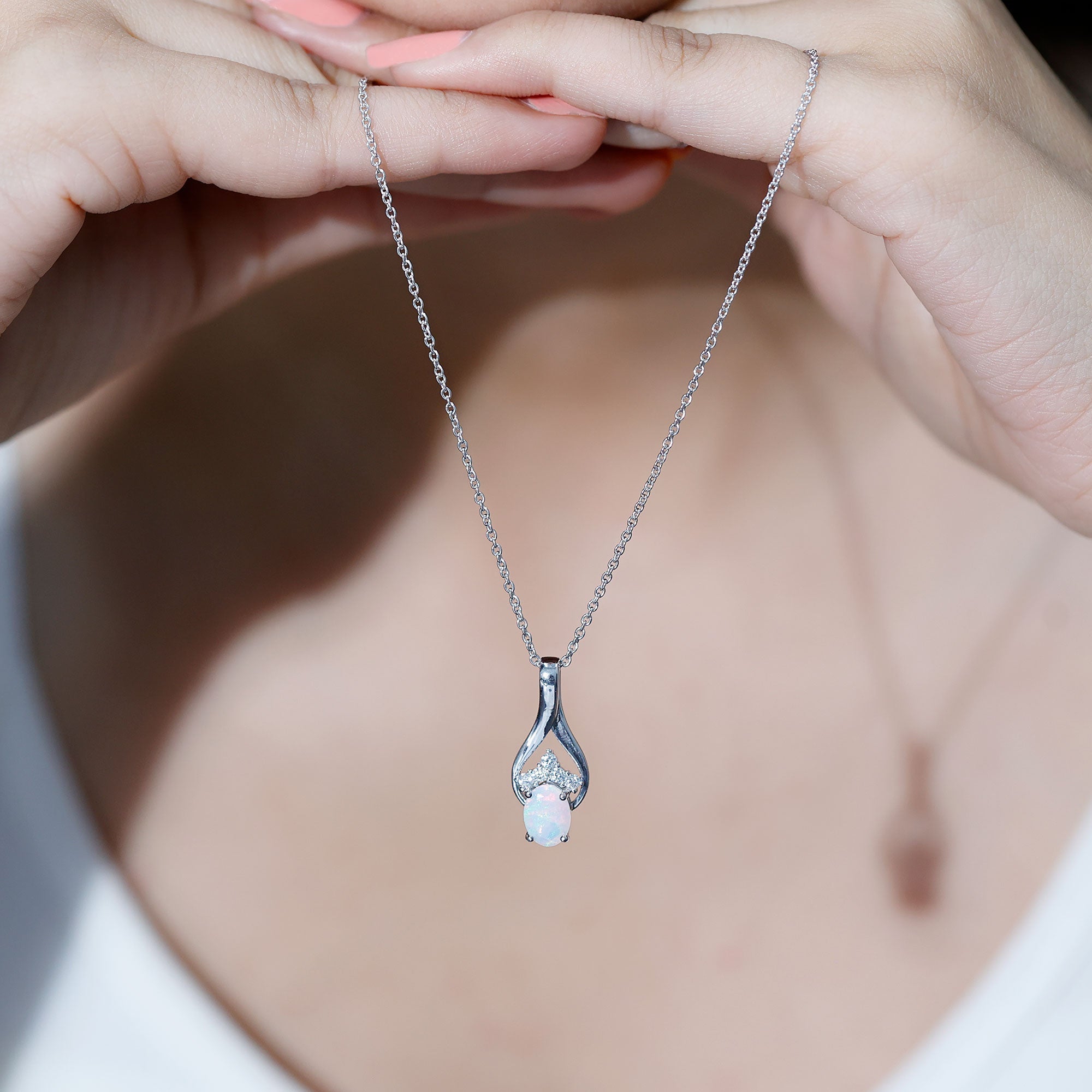 1.2 Carat Oval Ethiopian Opal Teardrop Pendant in Silver