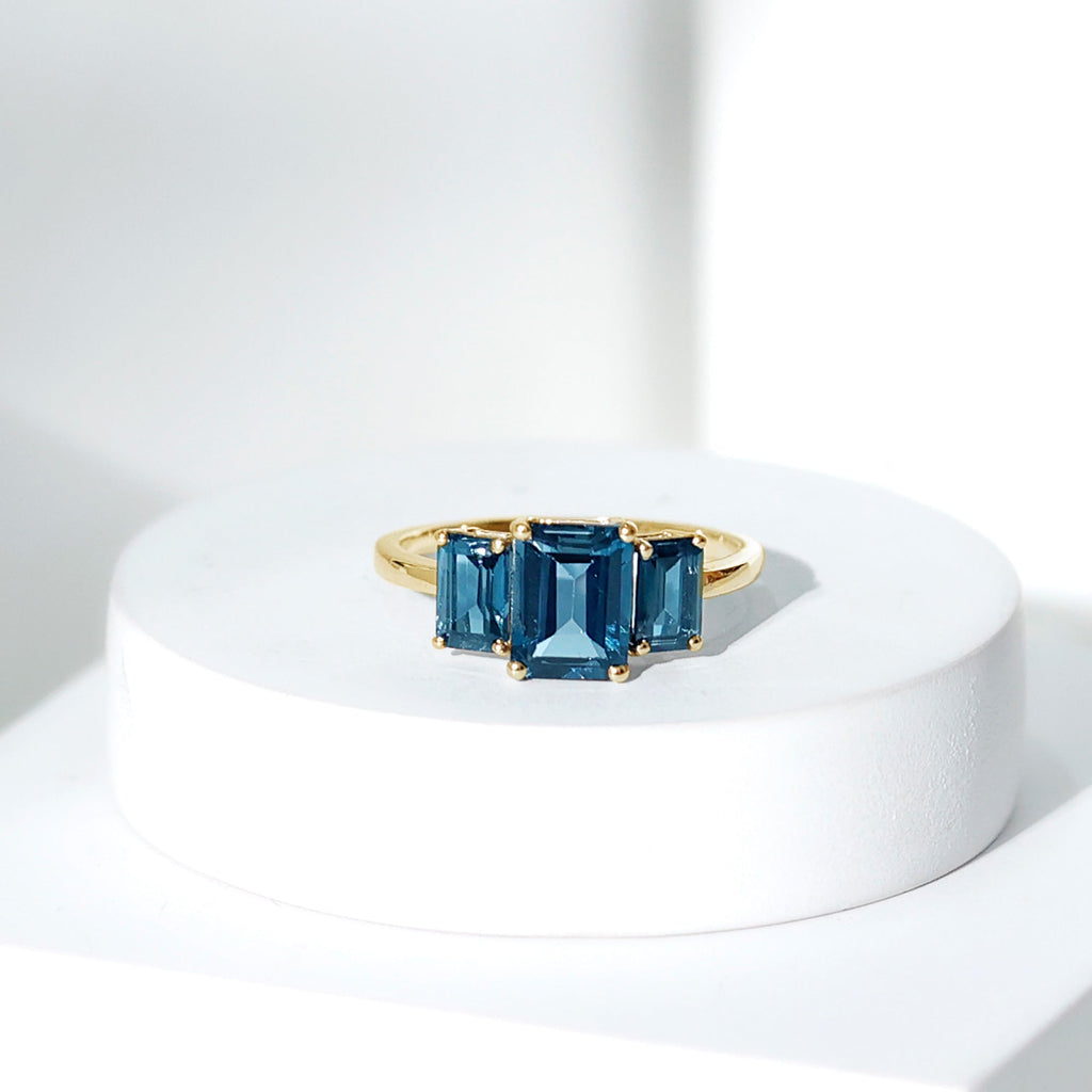 Emerald Cut London Blue Topaz Three Stone Engagement Ring