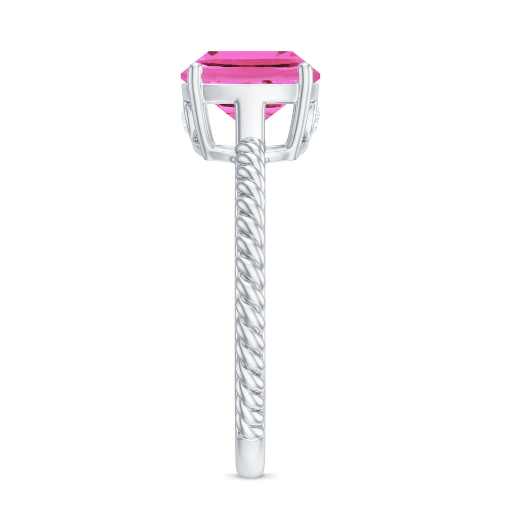 Side view of a created pink sapphire solitaire engagement ring with a twisted rope band