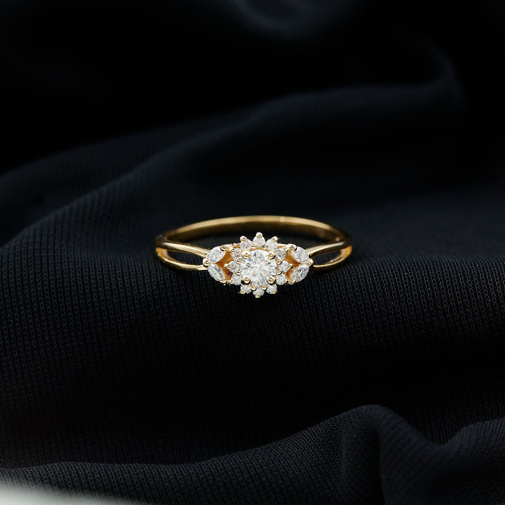 A gold ring with a large diamond center stone is displayed on a black fabric background.