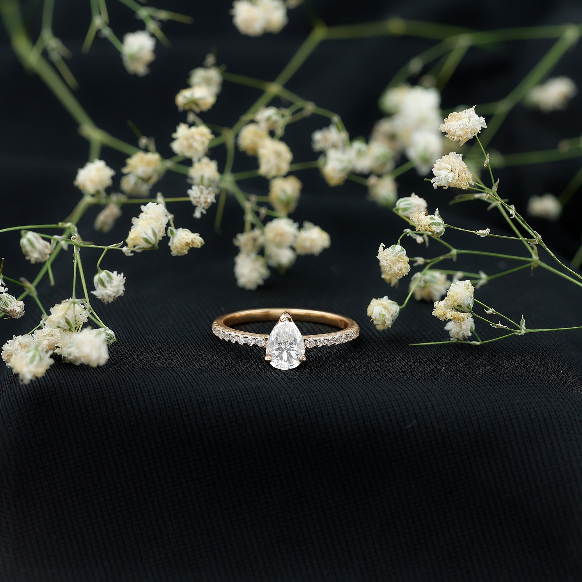0.6 Carat Pear Cut Man Made Diamond Engagement Ring
