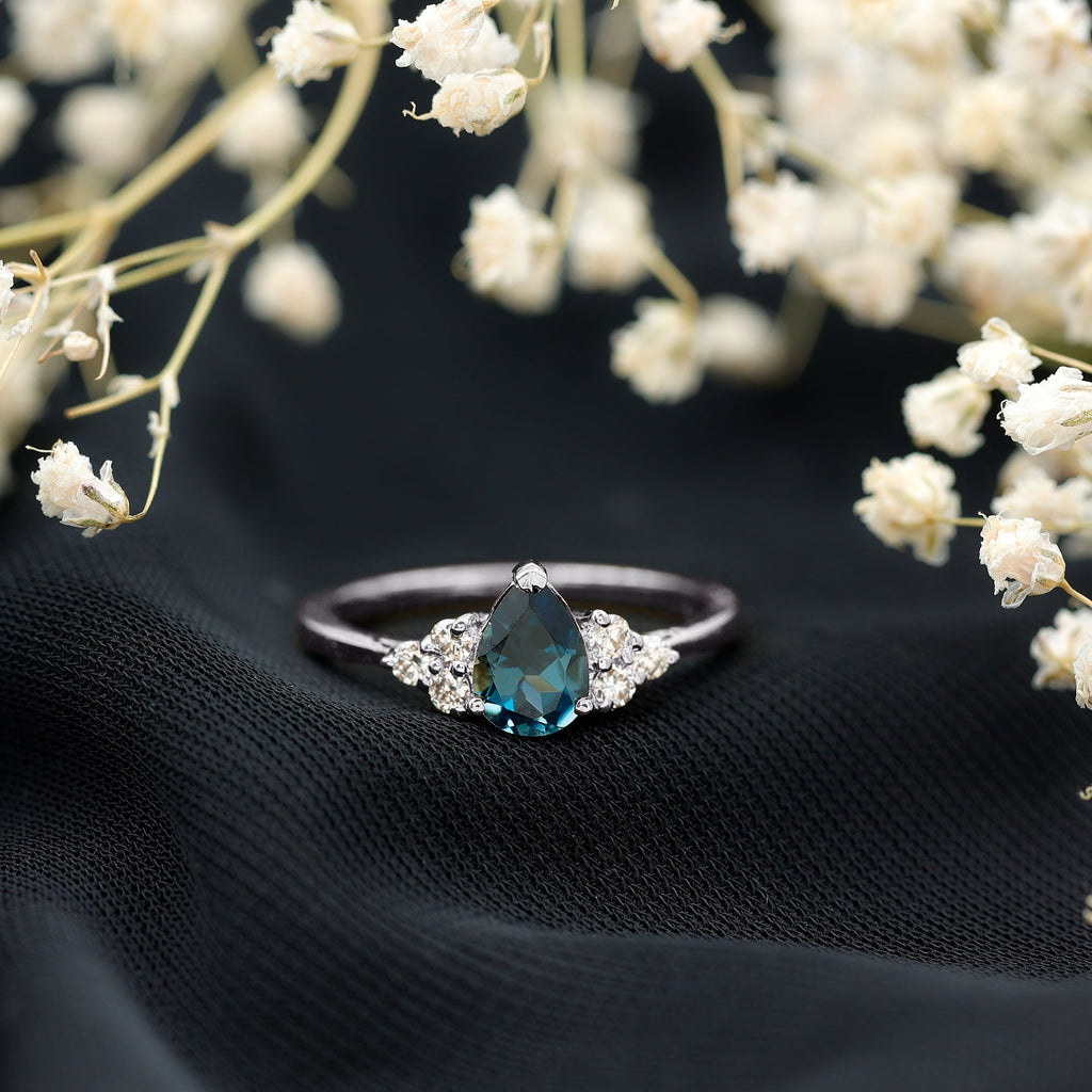 5X7mm Pear Shape London Blue Topaz Engagement Ring with Diamond Trio