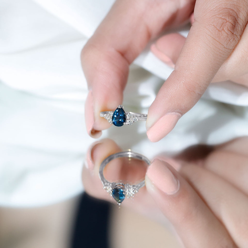 5X7mm Pear Shape London Blue Topaz Engagement Ring with Diamond Trio