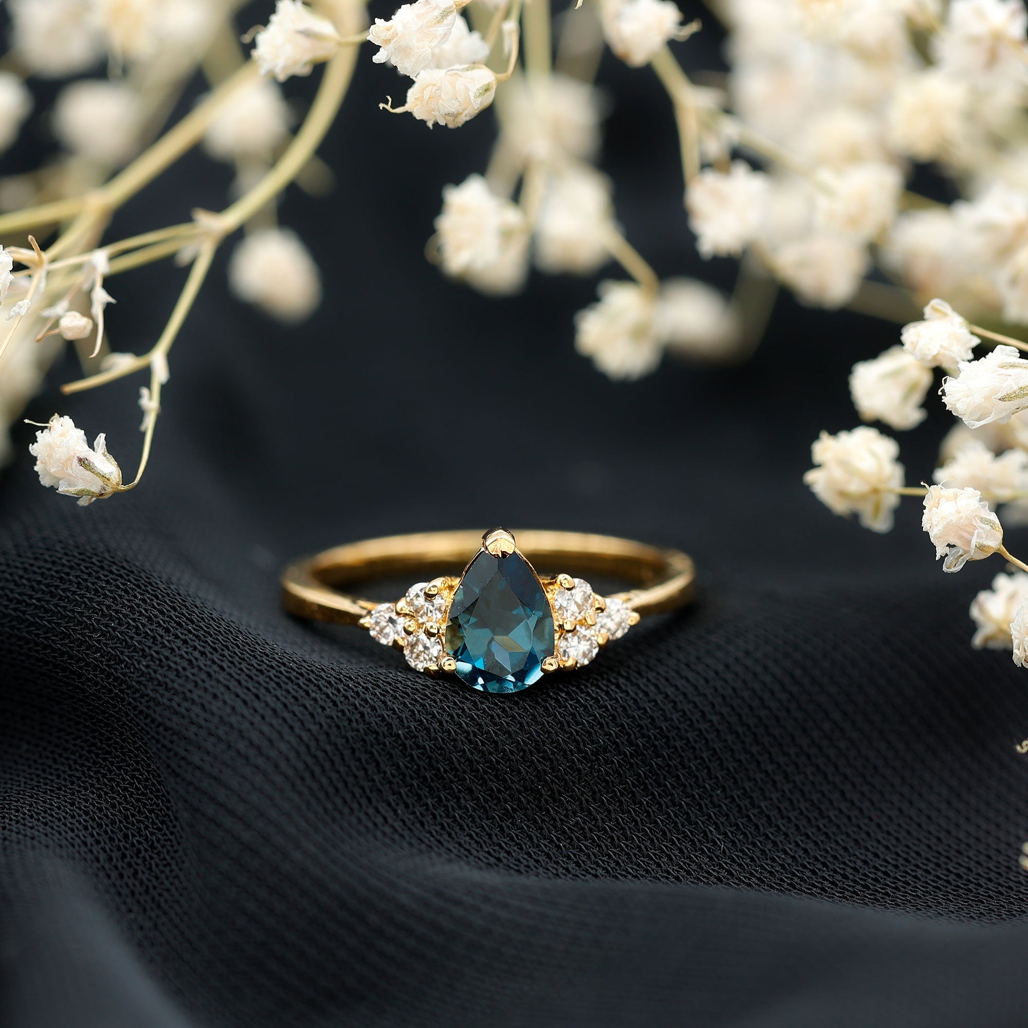 5X7mm Pear Shape London Blue Topaz Engagement Ring with Diamond Trio