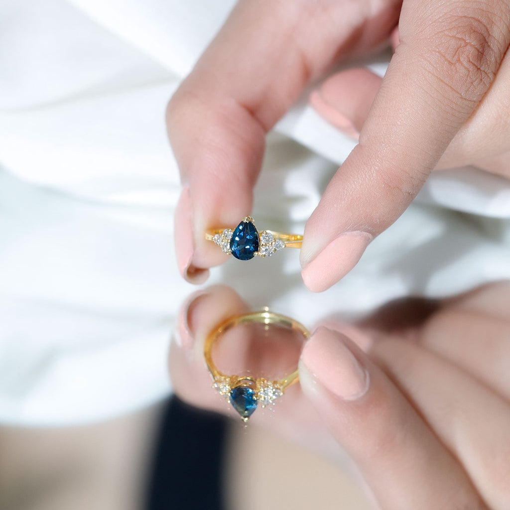 5X7mm Pear Shape London Blue Topaz Engagement Ring with Diamond Trio