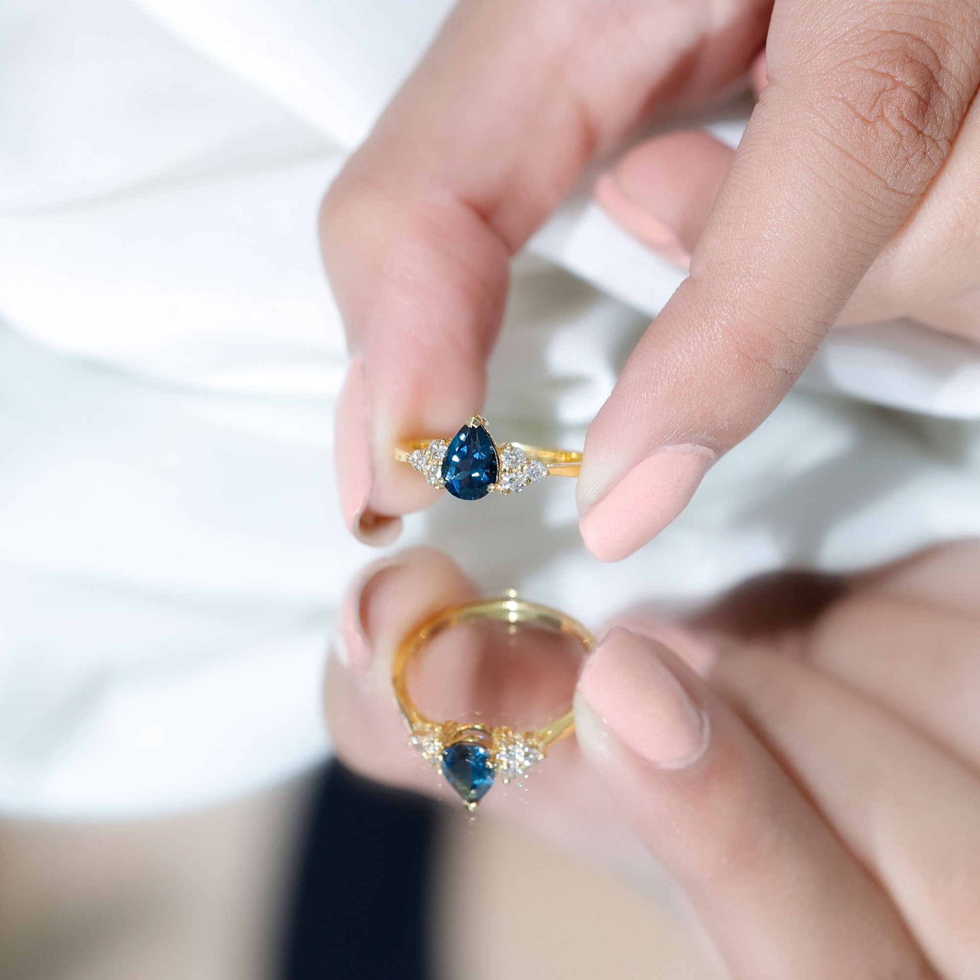 5X7mm Pear Shape London Blue Topaz Engagement Ring with Diamond Trio