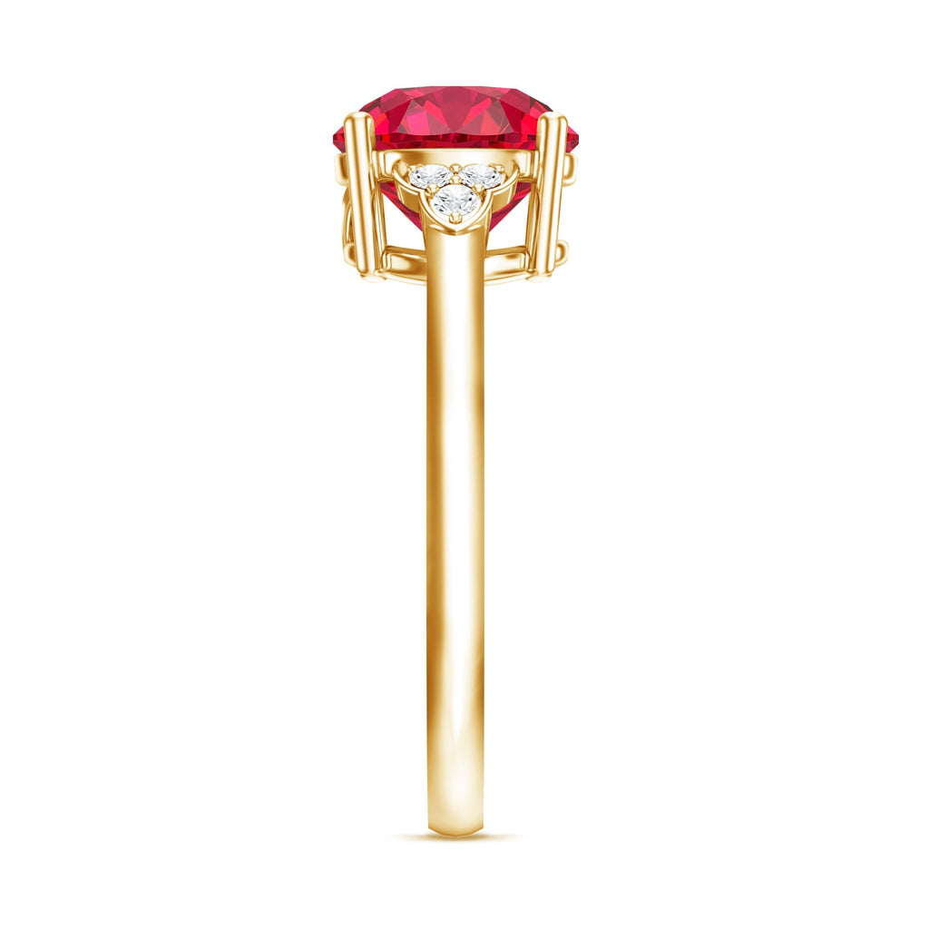 Side profile of a lab grown ruby solitaire engagement ring with a diamond trio set in yellow gold