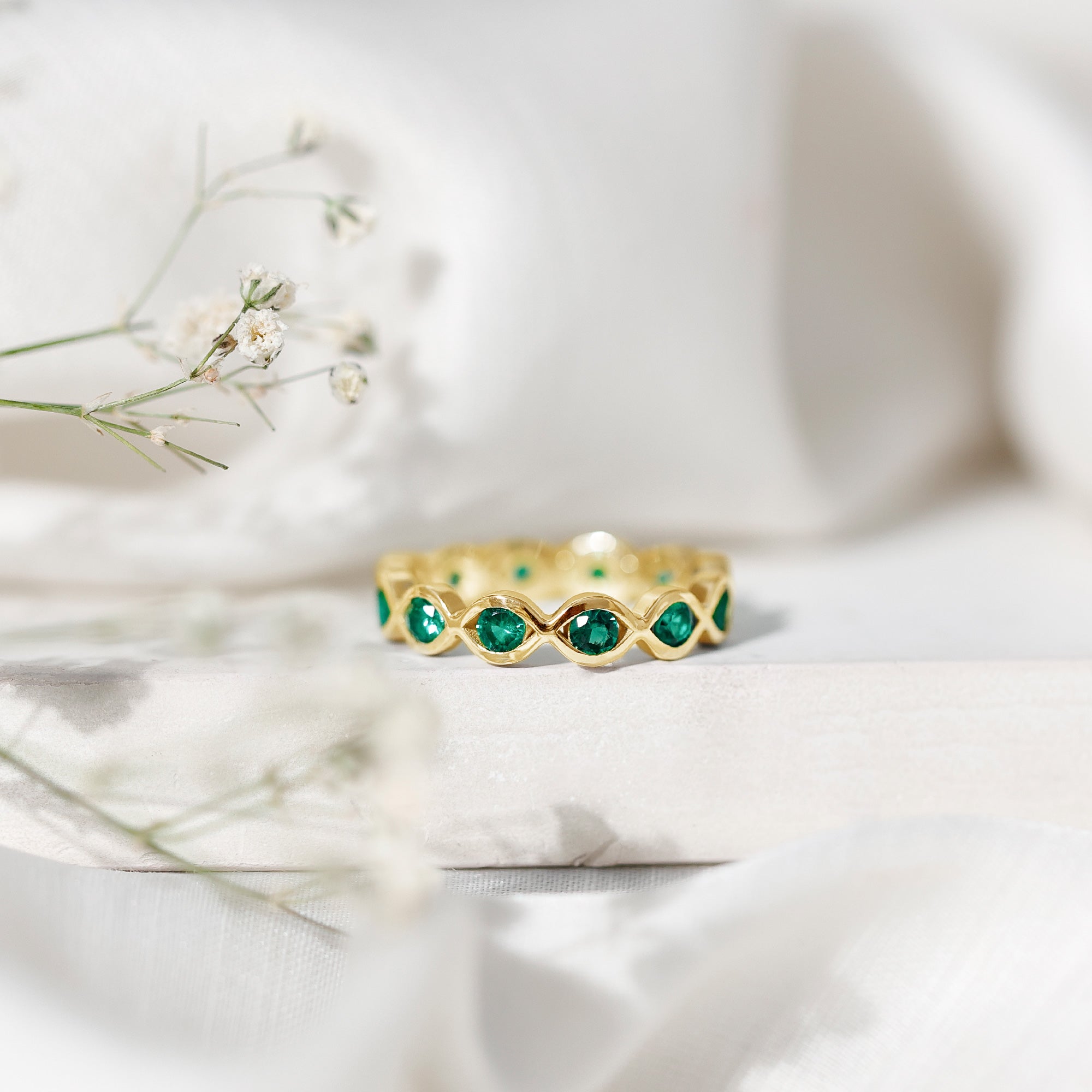 Lab Grown Emerald Ring – Infinity Twist Eternity Band With Brilliant Cut Stones