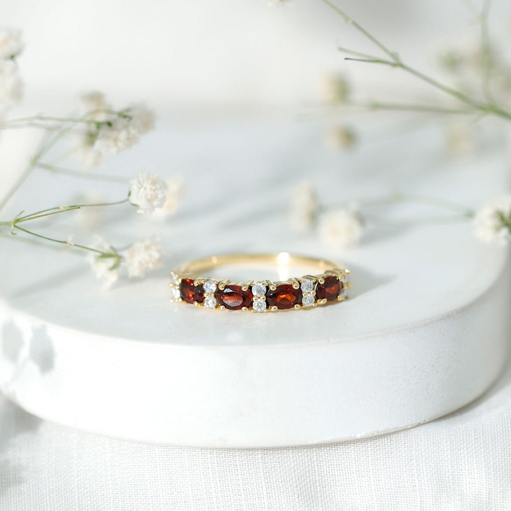 Garnet Eternity Ring – Yellow Gold Half Eternity Band with Oval Cut Stones