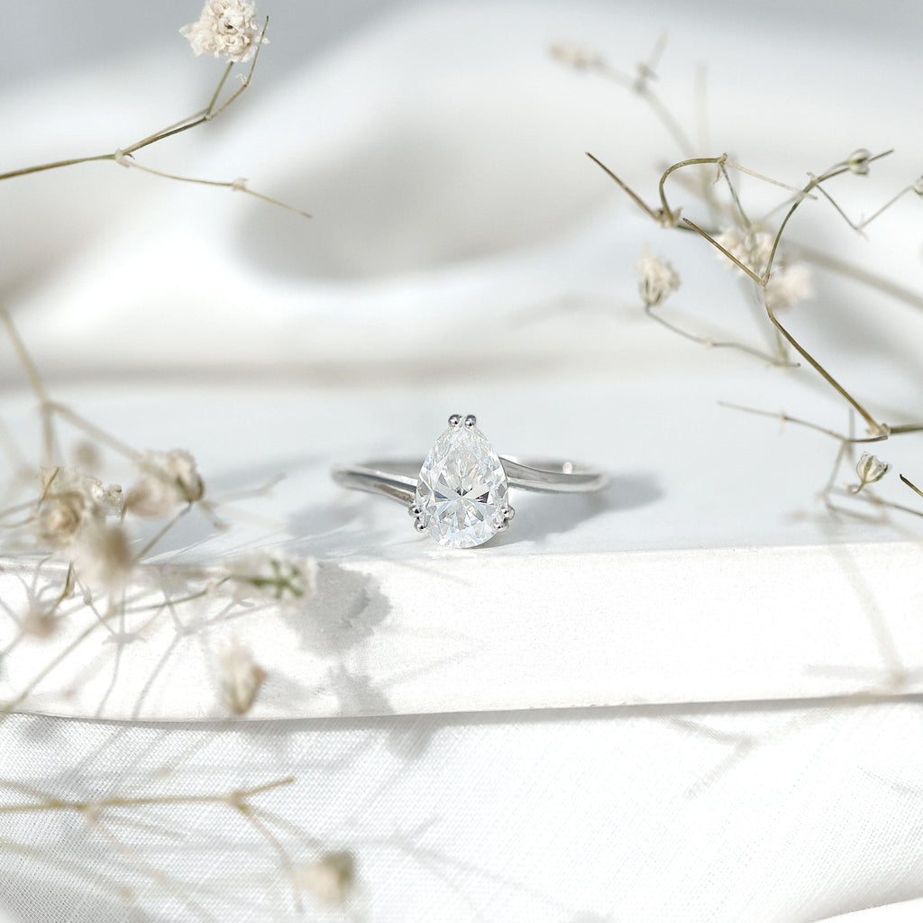 Pear Moissanite Ring – 2 Carat Solitaire Engagement With Bypass Design Elegance