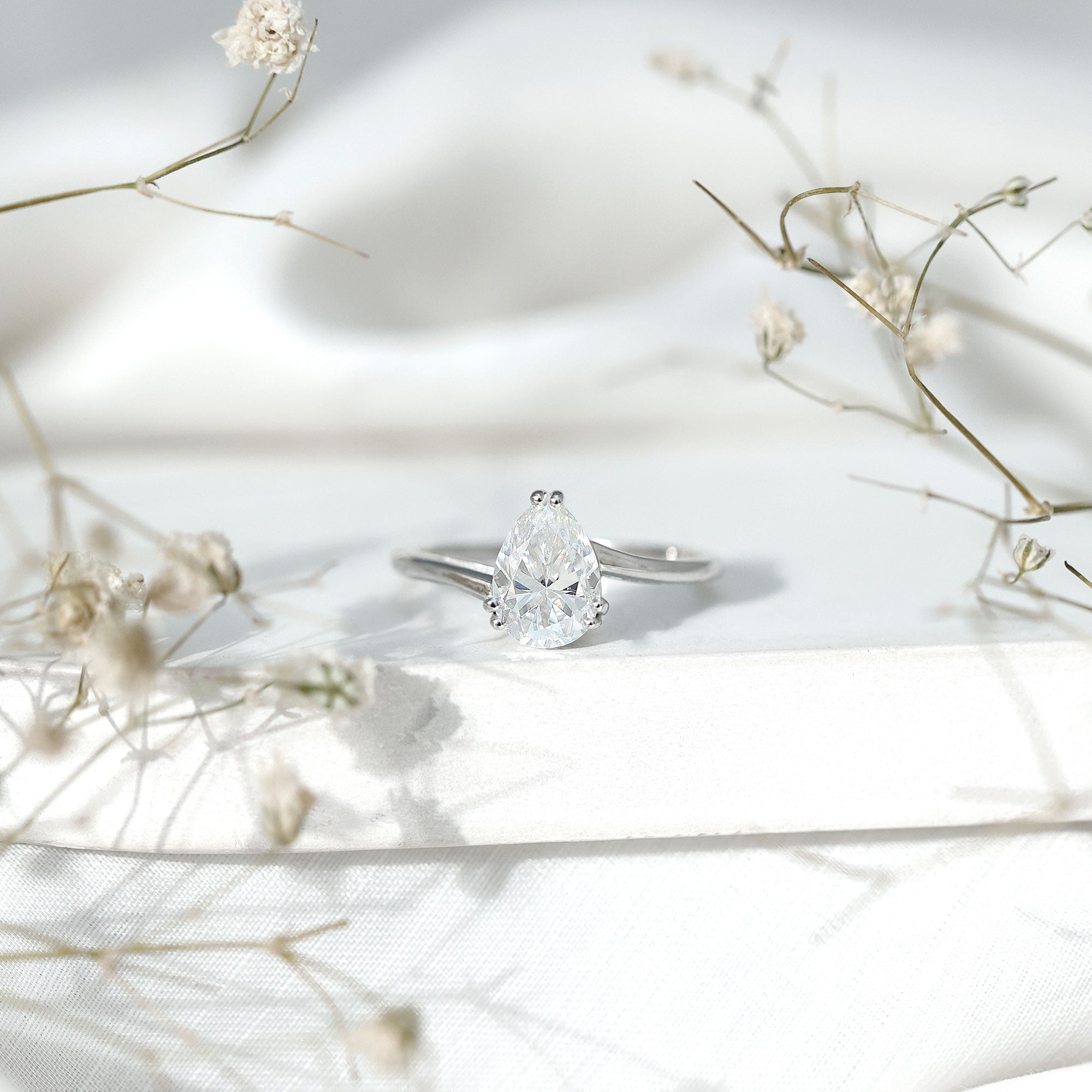 Pear Moissanite Ring – 2 Carat Solitaire Engagement With Bypass Design Elegance