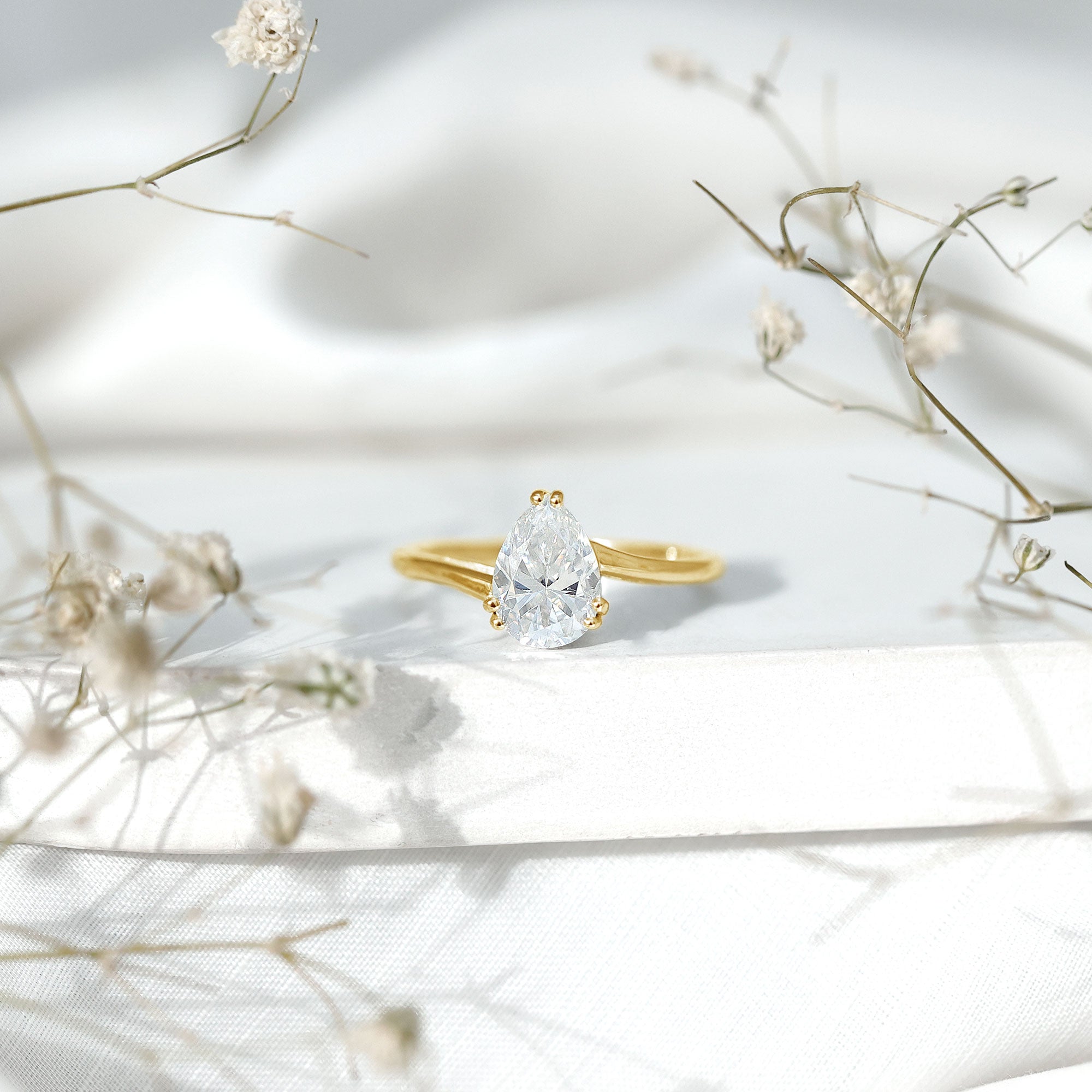 Pear Moissanite Ring – 2 Carat Solitaire Engagement With Bypass Design Elegance